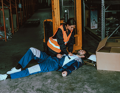 Female health worker treating an accident victim